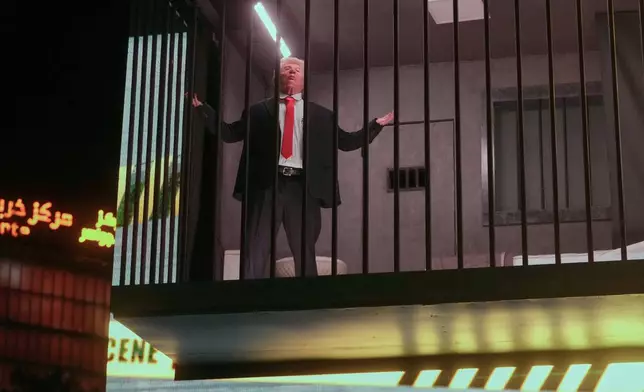 An actor portraying U.S. President Donald Trump sits behind bars in a billboard installation resembling a prison cell in Tajrish Square in Tehran, Iran, Wednesday, Oct. 21, 2026. (AP Photo/Vahid Salemi)