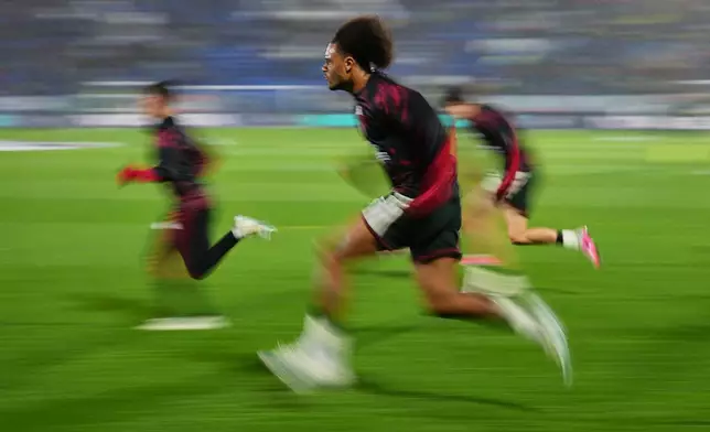 Manchester United's Joshua Zirkzee warms up before the Champions League opening phase soccer match between Como and Manchester United in Como, Italy, Wednesday, Oct. 21, 2026. (AP Photo/Antonio Calanni)
