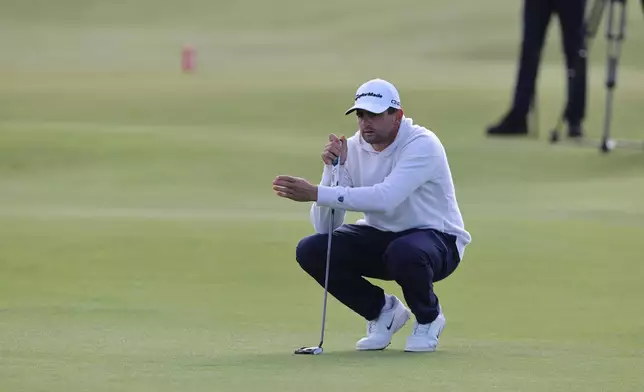 Casey Jarvis of South Africa lines up a putt on day three of the Dunhill Links Golf Championship in St Andrews, Scotland, Saturday, Oct. 3, 2026. (Steve Welsh/PA via AP)