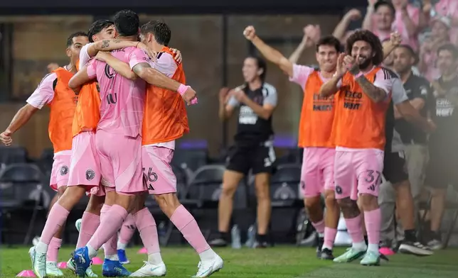 Inter Miami players celebrate after forward Luis Suarez (9) scored during the second half of an MLS soccer match against FC Cincinnati, Wednesday, Oct. 28, 2026, in Miami. (AP Photo/Rebecca Blackwell)