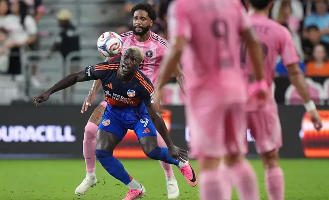 FC Cincinnati forward Kevin Denkey (9) controls the ball past Inter Miami defender Micael during the first half of an MLS soccer match, Wednesday, Oct. 28, 2026, in Miami. (AP Photo/Rebecca Blackwell)