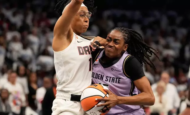 Golden State Valkyries guard Tiffany Hayes (15) drives the ball to the basket against Atlanta Dream guard Allisha Gray (15) during Game 4 of the WNBA basketball finals on Saturday, Oct. 24, 2026, in Atlanta. (AP Photo/Brynn Anderson)