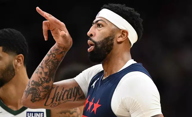 Washington Wizards forward/center Anthony Davis gestures after he made a basket during the first half of an NBA basketball game against the Milwaukee Bucks, Wednesday, Oct. 21, 2026, in Washington. (AP Photo/Nick Wass)