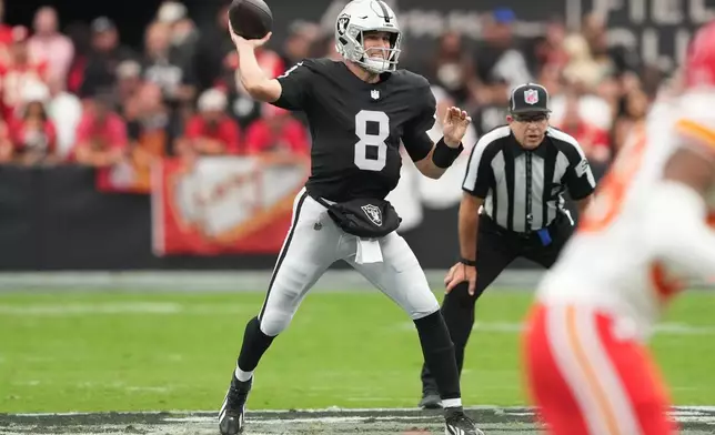 Las Vegas Raiders quarterback Kirk Cousins (8) looks to pass during the first half of an NFL football game against the Kansas City Chiefs in Las Vegas, Sunday, Oct. 4, 2026. (AP Photo/Rick Scuteri)