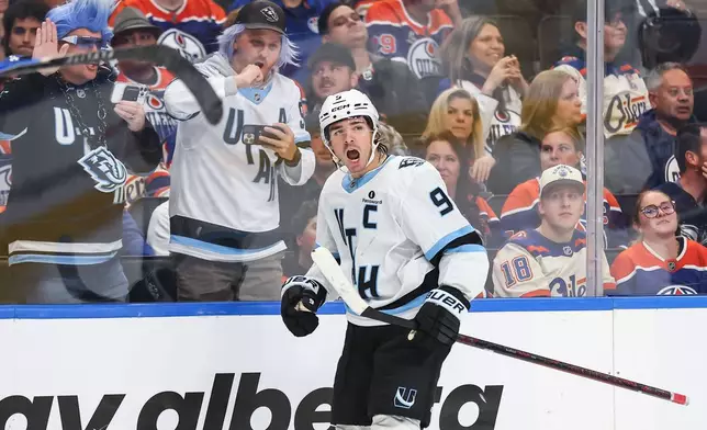 Utah Mammoth's Clayton Keller (9) celebrates a goal against the Edmonton Oilers during the third period of an NHL hockey game in Edmonton, Thursday, Oct. 15, 2026. (Codie McLachlan/The Canadian Press via AP)