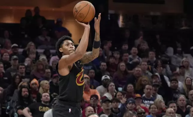 Cleveland Cavaliers guard Meleek Thomas shoots and hits a three-point basket in the second half of an NBA basketball game against the Minnesota Timberwolves, Monday, Oct. 26, 2026, in Cleveland. (AP Photo/Sue Ogrocki.