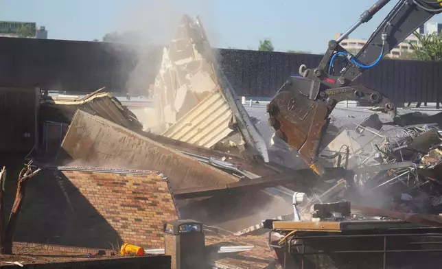 The Southside Community Center is demolished as work begins to build the National Juneteenth Museum during an event honoring Opal Lee's 100th birthday, Wednesday, Oct. 7, 2026, in Fort Worth, Texas. (AP Photo/Julio Cortez)