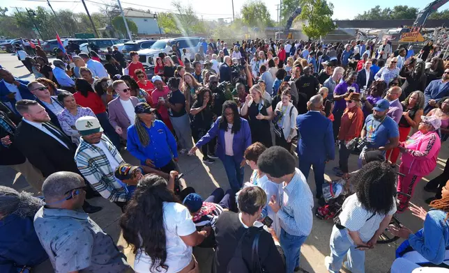 Opal Lee, bottom center, is surrounded by supporters during an event honoring her 100th birthday Wednesday, Oct. 7, 2026, in Fort Worth, Texas. (AP Photo/Julio Cortez)
