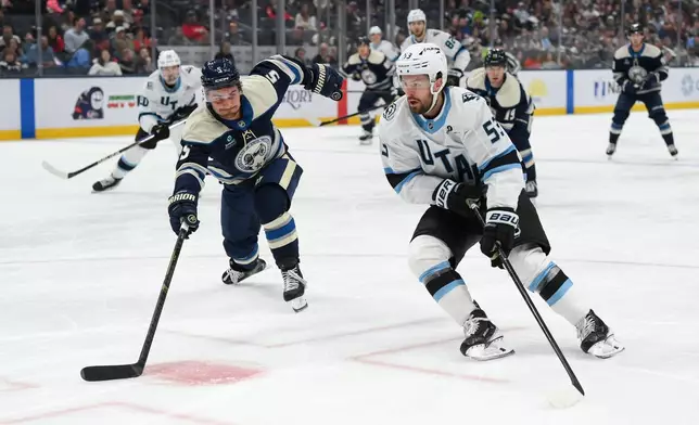 Utah Mammoth left wing Michael Carcone (53) skates against Columbus Blue Jackets' defenseman Denton Mateychuk (5) during the second period of an NHL hockey game, Saturday, Oct. 3, 2026, in Columbus, Ohio. (AP Photo/Tanner Pearson)