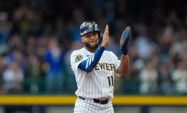 Milwaukee Brewers' Jackson Chourio reacts after an RBI single hit by Brice Turang during the first inning of a baseball game against the St. Louis Cardinals, Sunday, Sept. 27, 2026, in Milwaukee. (AP Photo/Kayla Wolf)