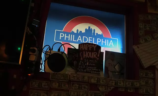 A London Underground tube logo with "Philadelphia" written on it is displayed at Passyunk Avenue bar, a Philadelphia sports teams bar in London, Wednesday, Oct. 7, 2026. (AP Photo/Alastair Grant)