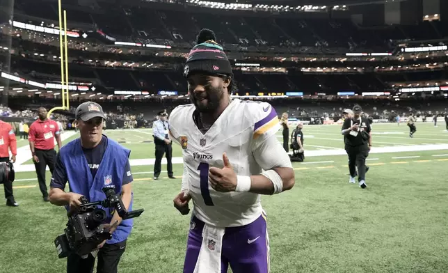 Minnesota Vikings quarterback Kyler Murray (1) jogs off the field after an NFL football game against the New Orleans Saints in New Orleans, Sunday, Oct. 11, 2026. (AP Photo/Matthew Hinton)