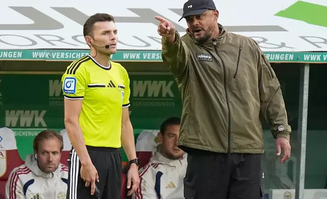 FILE - Bayern's head coach Vincent Kompany argues with the referee after the German Bundesliga soccer match between FC Augsburg and FC Bayern Munich in Augsburg, Germany, Oct. 10, 2026. (AP Photo/Matthias Schrader, File)