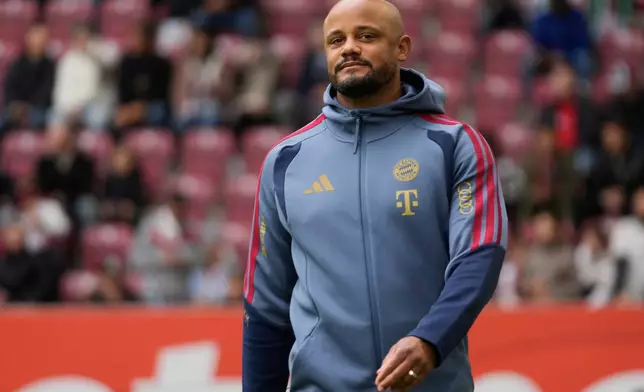 Bayern's head coach Vincent Kompany arrives for the German Bundesliga soccer match between FC Augsburg and FC Bayern Munich in Augsburg, Germany, Oct. 10, 2026. (AP Photo/Matthias Schrader)