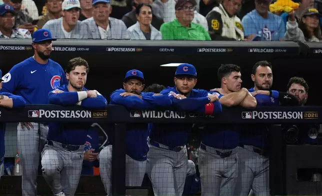 The Chicago Cubs dugout watches in the seventh inning against the San Diego Padres in Game 2 of the National League Wild Card baseball playoff series Wednesday, Sept. 30, 2026, in San Diego. (AP Photo/Gregory Bull)