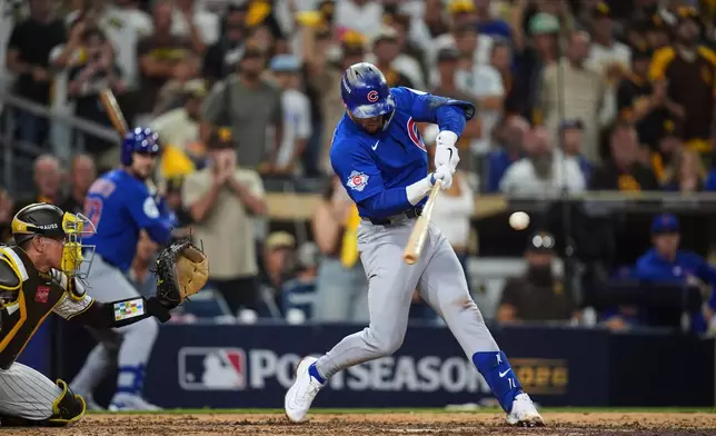 Chicago Cubs second baseman Nico Hoerner hits a double against the San Diego Padres in the 9th inning of Game 2 of the National League Wild Card baseball playoff series Wednesday, Sept. 30, 2026, in San Diego. (AP Photo/Gregory Bull)