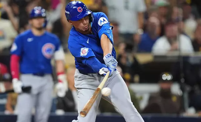 Chicago Cubs Tyrone Taylor singles against the San Diego Padres in the eighth inning of Game 2 of the National League Wild Card baseball playoff series Wednesday, Sept. 30, 2026, in San Diego. (AP Photo/Gregory Bull)