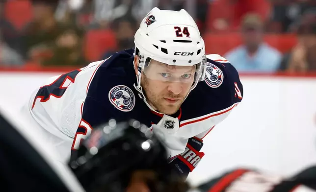 Columbus Blue Jackets' Mathieu Olivier (24) watches the puck during the first period of an NHL hockey game against the Carolina Hurricanes in Raleigh, N.C., Thursday, Oct. 29, 2026. (AP Photo/Karl DeBlaker)
