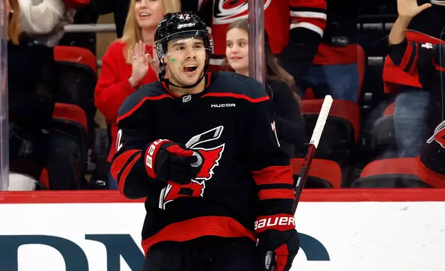 Carolina Hurricanes' Logan Stankoven (22) celebrates after his goal during the second period of an NHL hockey game against the Columbus Blue Jackets in Raleigh, N.C., Thursday, Oct. 29, 2026. (AP Photo/Karl DeBlaker)