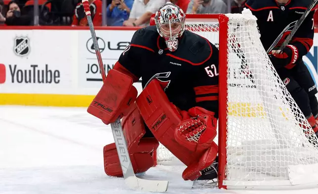 Carolina Hurricanes goaltender Pyotr Kochetkov (52) watches the puck during the first period of an NHL hockey game against the Columbus Blue Jackets in Raleigh, N.C., Thursday, Oct. 29, 2026. (AP Photo/Karl DeBlaker)