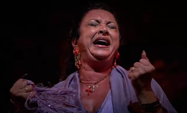 Flamenco singer Fabiola Pérez, known as "La Fabi", performs on a stage during a concert organized as part of the Seville Flamenco Bienal in Seville, Spain, Thursday, Sept. 17, 2026. (AP Photo/Emilio Morenatti)