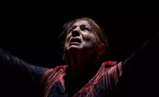 Flamenco dancer Juana Amaya performs on a stage during a concert organized as part of the Seville Flamenco Bienal in Seville, Spain, Friday, Sept. 25, 2026. (AP Photo/Emilio Morenatti)