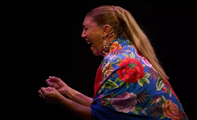 Flamenco singer Esperanza Fernandez performs on a stage during a concert organized as part of the Seville Flamenco Bienal in Seville, Spain, Thursday, Sept. 24, 2026. (AP Photo/Emilio Morenatti)