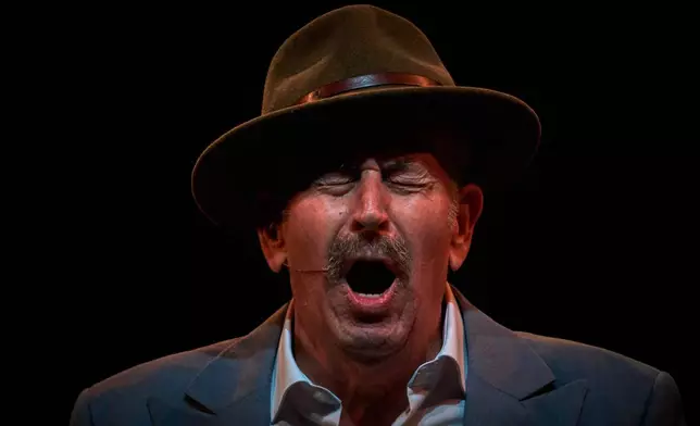 Flamenco singer José Manuel Escalera, known as "Nene Escalera", performs on a stage during a concert organized as part of the Seville Flamenco Bienal in Seville, Spain, Friday, Sept. 18, 2026. (AP Photo/Emilio Morenatti)