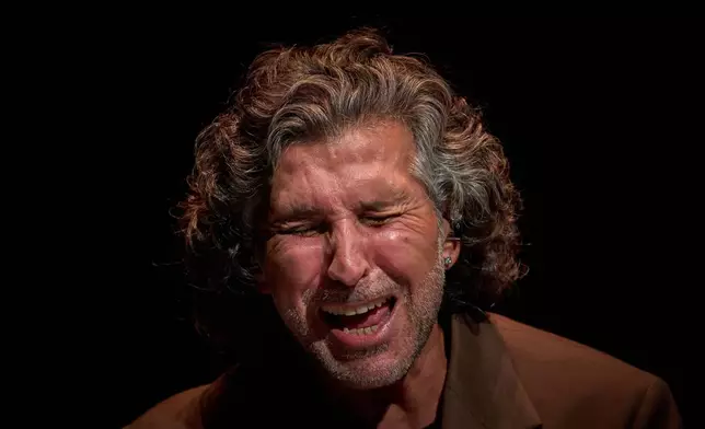 Flamenco singer Francisco José, known as "Arcángel", performs on a stage during a concert organized as part of the Seville Flamenco Bienal in Seville, Spain, Thursday, Sept. 17, 2026. (AP Photo/Emilio Morenatti)