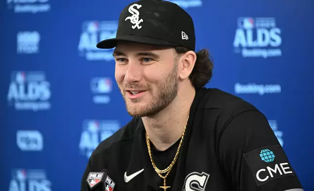 Chicago White Sox relief pitcher Sean Burke talks to reporters after Game 2 of baseball's American League Division Series against the Cleveland Guardians, Monday, Oct. 5, 2026, in Cleveland. (AP Photo/Phil Long)