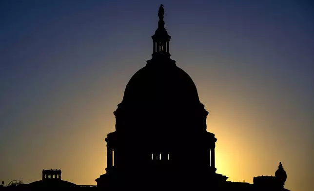 The sun rises behind the Capitol Dome in Washington, Tuesday, Oct. 20, 2026, two weeks before the midterm elections that will determine political control of Congress. (AP Photo/J. Scott Applewhite)