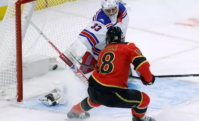 Ottawa Senators' Tim Stutzle (18) scores against New York Rangers goaltender Dylan Garand (33) during the first period of an NHL hockey game in Ottawa, Ontario, Saturday, Oct. 24, 2026. (Patrick Doyle/The Canadian Press via AP)