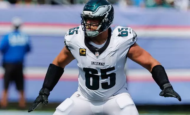 FILE - Philadelphia Eagles tackle Lane Johnson (65) prepares to block during the second half of an NFL football game against the Tennessee Titans in Nashville, Tenn., Sunday, Sept. 20, 2026. (AP Photo/Stew Milne, File)
