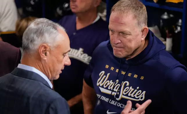 MLB Commissioner Rob Manfred, left, speaks with Milwaukee Brewers manager Pat Murphy prior to Game 1 of baseball's World Series, Friday, Oct. 23, 2026, in Milwaukee, between the Milwaukee Brewers and the Tampa Bay Rays. (AP Photo/Ashley Landis)