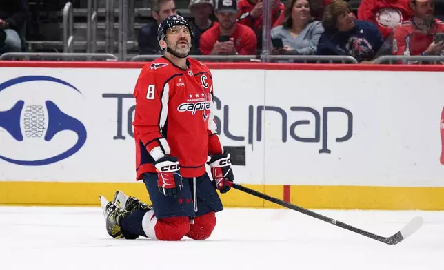 Washington Capitals left wing Alex Ovechkin looks up at the scoreboard during the second period of an NHL hockey game against the Montreal Canadiens, Wednesday, Oct. 14, 2026, in Washington. (AP Photo/Nick Wass)