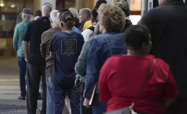 Voters line up for the first hour of early voting at Metropolitan Multi-Service Center in Houston, Monday, Oct. 19, 2026. (Elizabeth Conley/Houston Chronicle via AP)
