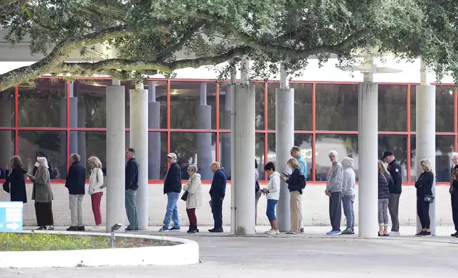 Voters line up for the first hour of early voting at Metropolitan Multi-Service Center in Houston, Monday, Oct. 19, 2026. (Elizabeth Conley/Houston Chronicle via AP)