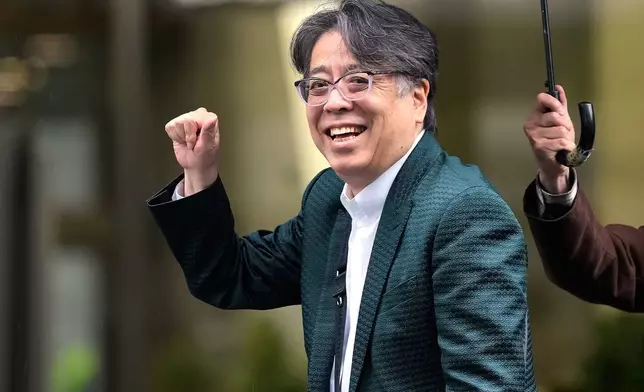 Japanese manga artist Yoshinori Kobayashi, who has written books on history and monarchy, arrives at the Tokyo District Court in Tokyo, Monday, Oct. 26, 2026. (AP Photo/Eugene Hoshiko)