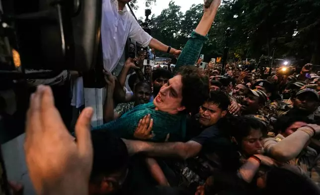 Police detain India's opposition Congress party leader and lawmaker Priyanka Gandhi Vadra and place her and other protesters in a police vehicle during a protest demanding the resignation of Chief Election Commissioner Gyanesh Kumar in New Delhi, India, Wednesday, Oct. 7, 2026 (AP Photo/Manish Swarup)