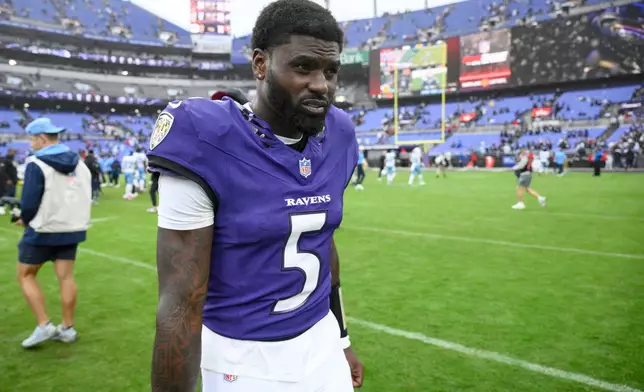 Baltimore Ravens quarterback Tyler Huntley (5) walks off the field after the team's win in an NFL football game against the Tennessee Titans in Baltimore, Sunday, Oct. 4, 2026. (AP Photo/Nick Wass)