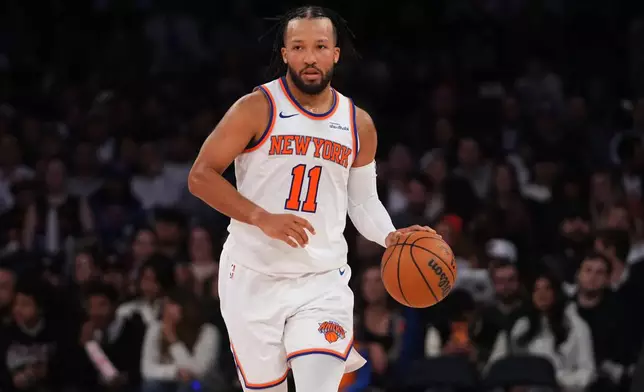 New York Knicks' Jalen Brunson (11) looks to pass during the second half of a preseason NBA basketball game against the Toronto Raptors Thursday, Oct. 15, 2026, in New York. (AP Photo/Frank Franklin II)