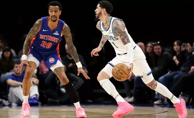Minnesota Timberwolves guard LaMelo Ball, right, works around Detroit Pistons forward John Collins (20) during the first half of a preseason NBA basketball game Wednesday, Oct. 14, 2026, in Minneapolis. (AP Photo/Matt Krohn)