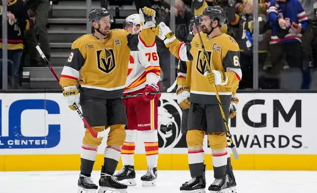 Vegas Golden Knights right wing Mark Stone (61) celebrates this third goal against the Calgary Flames during the third period of an NHL hockey game Thursday, Oct. 15, 2026, in Las Vegas. (AP Photo/John Locher)