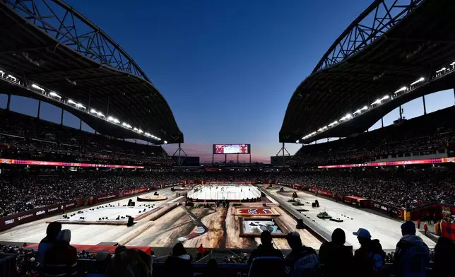 The Winnipeg Jets and the Montreal Canadiens play during the first period of NHL Heritage Classic hockey game in Winnipeg, Manitoba, Sunday, Oct. 25, 2026. (Fred Greenslade/The Canadian Press via AP)
