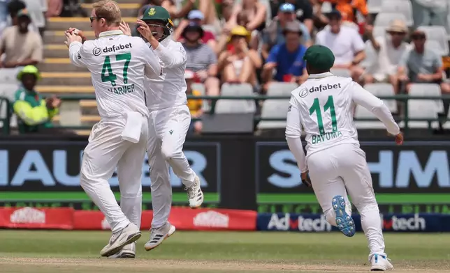 South Africa's Simon Harmer, celebrates the wicket of Australia's batsman Josh Inglis on day five of the third cricket test match between South Africa and Australia, in Cape Town, South Africa, Saturday, Oct. 31, 2026. (AP Photo/Halden Krog)