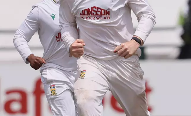 South Africa's Simon Harmer celebrates his second wicket on day five of the third cricket test match between South Africa and Australia, in Cape Town, South Africa, Saturday, Oct. 31, 2026. (AP Photo/Halden Krog)