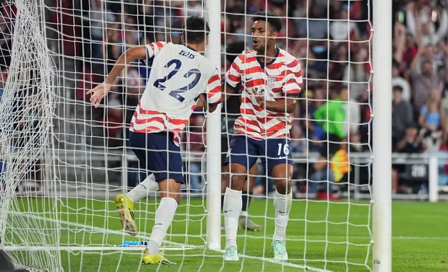 United States' Justin Ellis (22) celebrates toward teammate Alex Freeman (16) after scoring a goal during the first half of an international friendly soccer match against Canada Tuesday, Oct. 6, 2026, in St. Paul, Minn. (AP Photo/Abbie Parr)