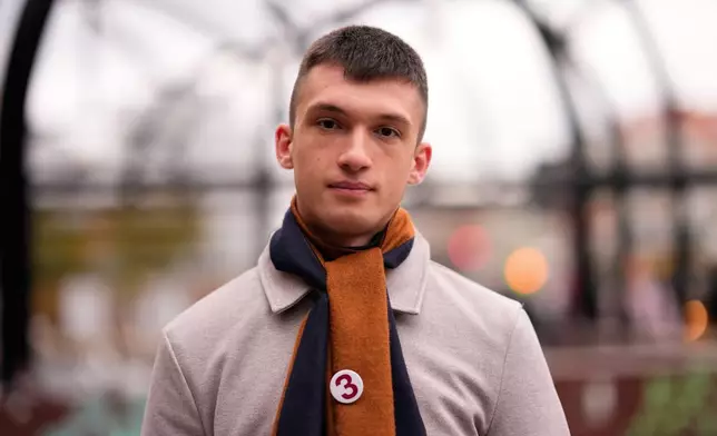 Ilhan Kokor, student of psychology, from Belgrade, 21, poses for a photo ahead of the election in Belgrade, Serbia, Thursday, Oct. 22, 2026. (AP Photo/Petr David Josek)