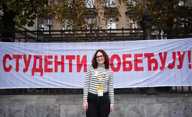 Mina Pejovic, student of pharmacy, from Belgrade, 26, poses for a photo ahead of the election in Belgrade, Serbia, Thursday, Oct. 22, 2026. (AP Photo/Petr David Josek)