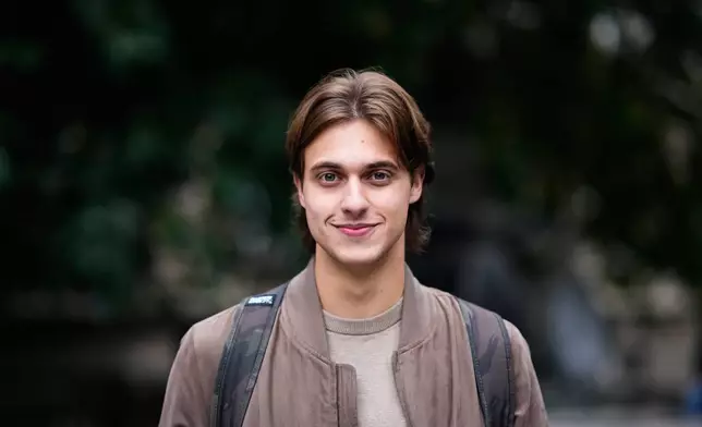 Mateja Radosavljevic, student of law, from Belgrade, 20, poses for a photo ahead of the election in Belgrade, Serbia, Thursday, Oct. 22, 2026. (AP Photo/Petr David Josek)